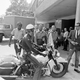 A police officer rolls his motorcycle in front of Birmingham demonstrators, including Rev. Ralph Abernathy, left, and Rev. Martin Luther King Jr., center.